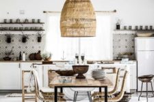 04 a boho eclectic kitchen and dining space with an oversized wicker lampshade over the dining zone and mosaic tiles