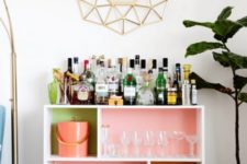 04 a bright home bar made of an IKEA Valje shelf with colored contact paper to spruce up the inside of each compartment