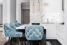 04 soft baby blue tufted stools on dark stained legs add color to the space and look very inviting and chic