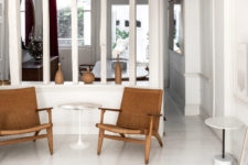 05 The home if decorated with understated elegance with marble tables, wicker chairs and wooden decor