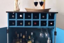 05 a bar cabinet in blue from a 3-drawer Tarva chest from IKEA using scraps of plywood and wood