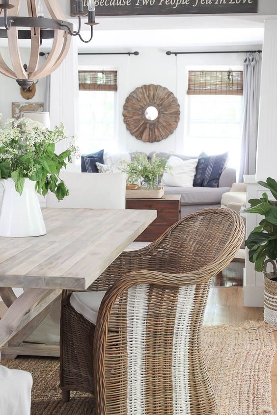 a comfortable wicker chair with white stripes will spruce up a rustic or farmhouse space making it feel summery