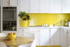 05 a lemon yellow accented kitchen with white cabinets and a yellow skinny tile backsplash that echoes bright accents and touches