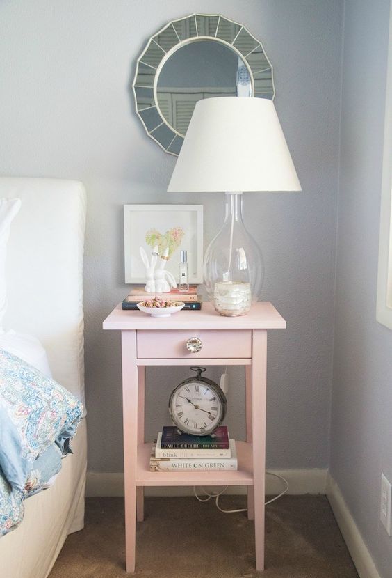 an IKEA Hemnes bedside table hacked in pink and with a metallic knob will add a girlish feel to the space