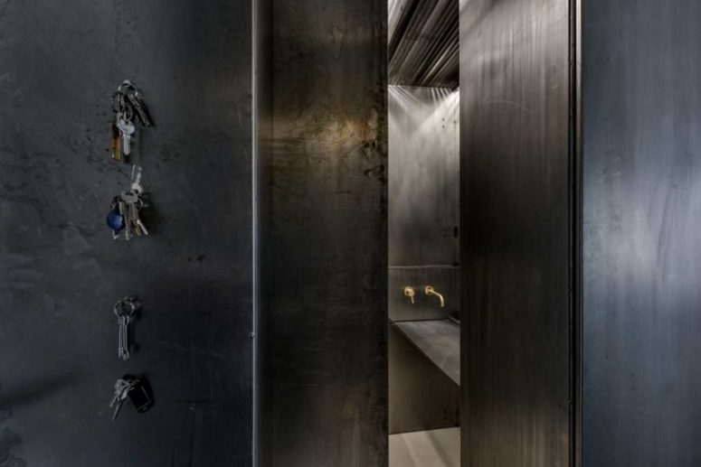Most of the apartment is clad with aged metal to give it an industrial feel