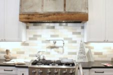 06 a modern farmhouse kitchen with white cabinets and a three tone skinny tile backsplash to add a touch of muted color
