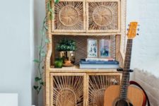 06 a rattan storage unit with potted greenery and other stuff is a great piece with a 70s feel