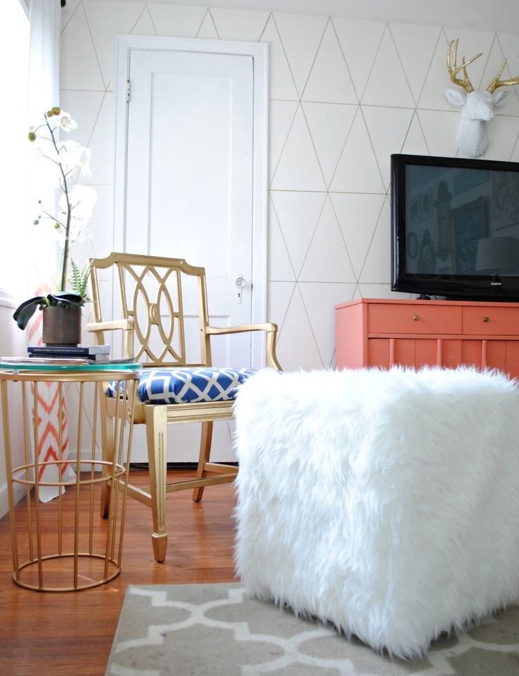 a glam ottoman made of a plywood cube and covered with an IKEA Tejn faux fur skin for a furry touch