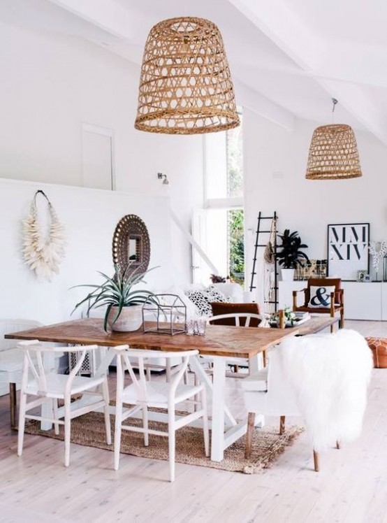 a modern tropical space spruced up with two matching wicker lampshades over the space for a strong beach feel
