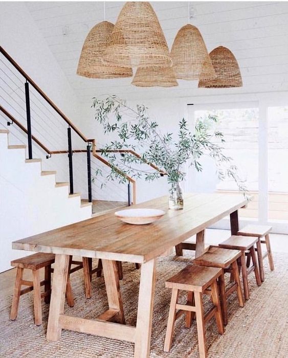A whole arrangement of wicker lampshades of a large scale are very outdoorsy and summer like