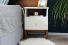 07 an IKEA Tarva nightstand spruced up with white paint, stained legs and a knob is a very cool idea