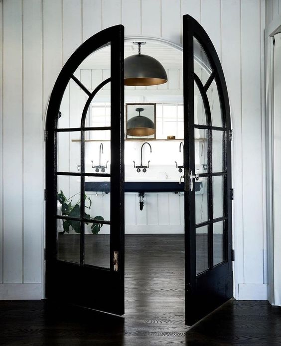 highlight the bathroom with black French arched doors liek these ones, and it will get a super chic look