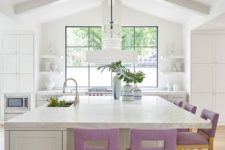 07 lilac upholstered stools add a touch of soft color to the neutral kitchen and make it cooler