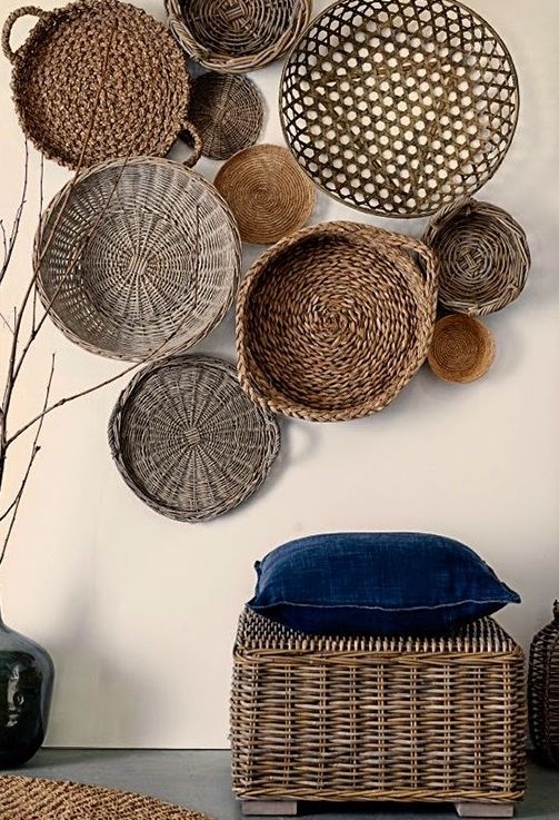 decorative wicker baskets and a wicker pouf that matches make the space more boho and outdoor-like