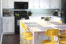08 industrial and vintage bright yellow stools spruce up the neutral and blue kitchen and stand out a lot