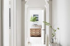08 turn your simple corridor into a chic space with arched doorways and vintage touches