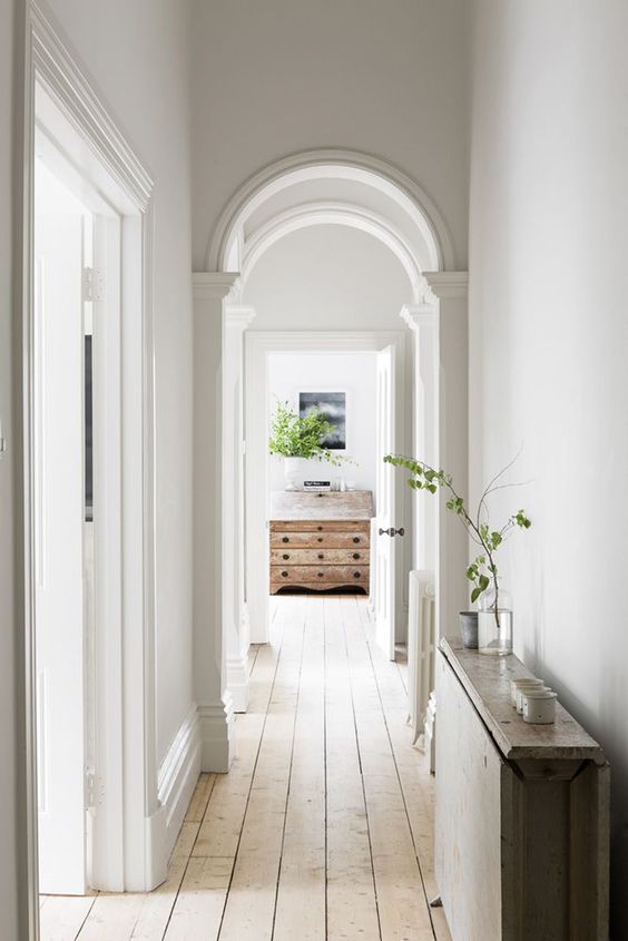 turn your simple corridor into a chic space with arched doorways and vintage touches