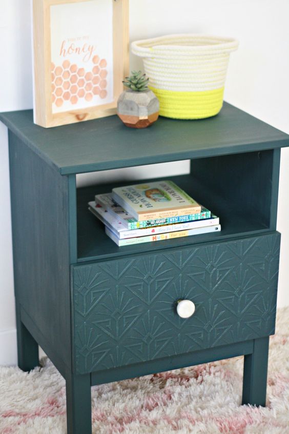 an IKEA Tarva nightstand is hacked with faux inlays, a white knob and in forest green color