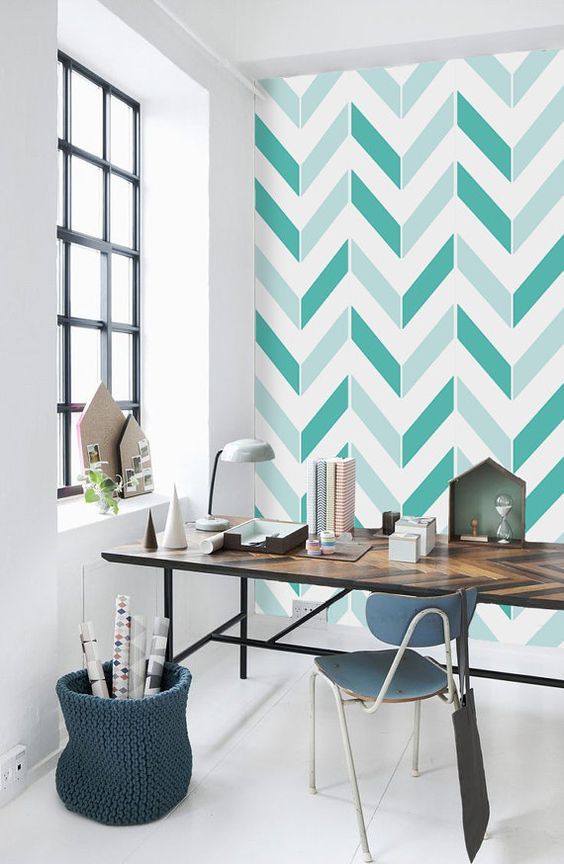bold mint and green chevron patterns on this statement eall refresh the home office and match the desk
