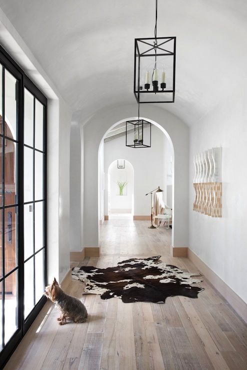 arched doorways make entryways and corridors catchy and chic, add pendant lamps to highlight it