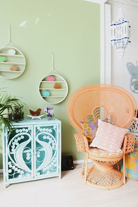 a bright orange peacock chair, a light blue cabinet will make your boho space very colorful and bright