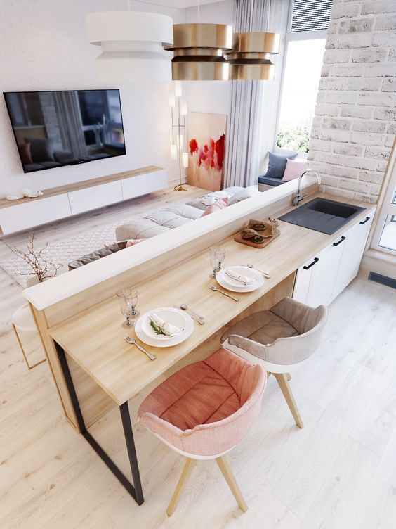 A neutral open layout done in white, cremay shades, light colored wood and plywood