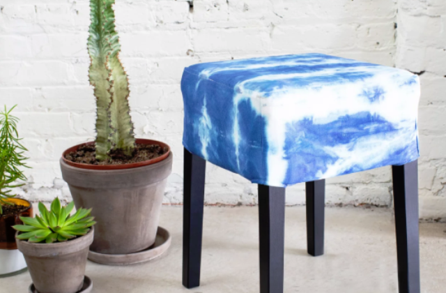 a small ottoman done with an IKEA Nils cover and a shibori dye kit will add color and pattern to the space