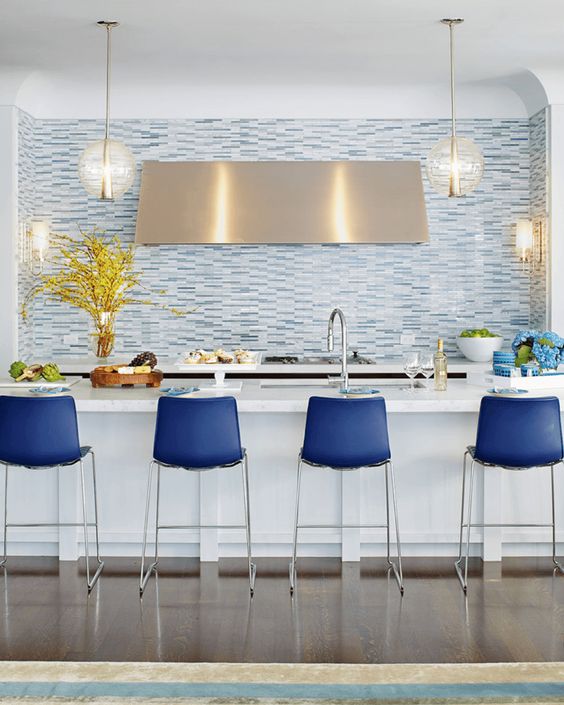 bright blue stools make a statement in the kitchen with their color and look wow