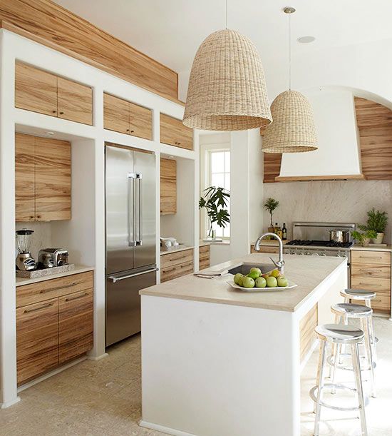 pendant wicker lamps and neutral plywood cabinets create a welcoming space with a rustic feel
