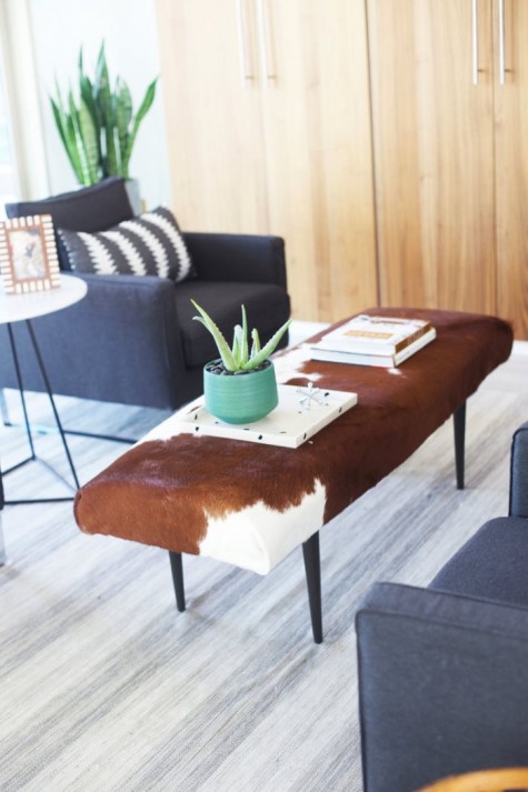 a stylish ottoman reupholstered with an IKEA Koldby Cowhide is a cool idea for a rustic or mid-century modern space