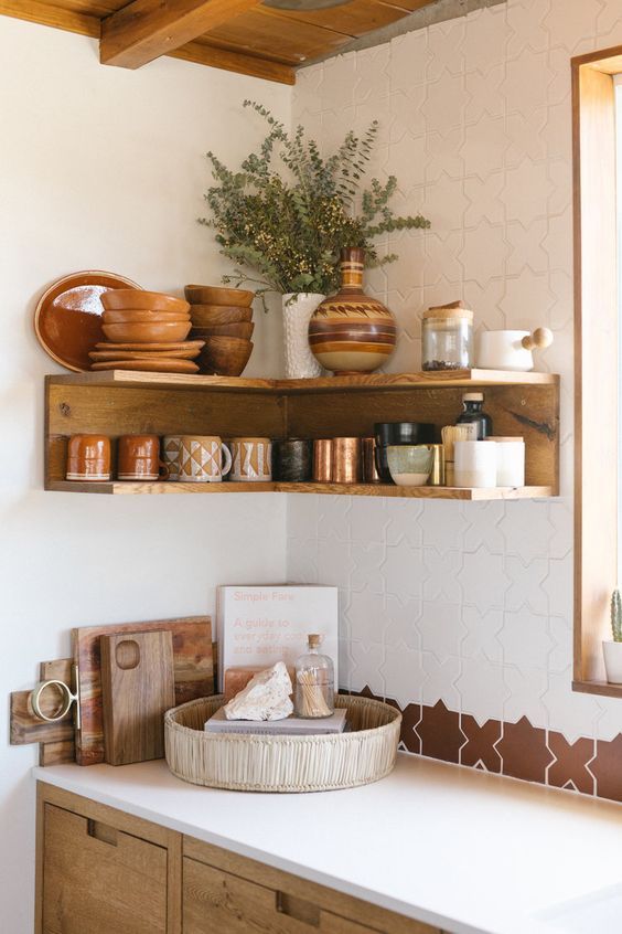 an open stained shelving unit in the corner will save much space for storing things