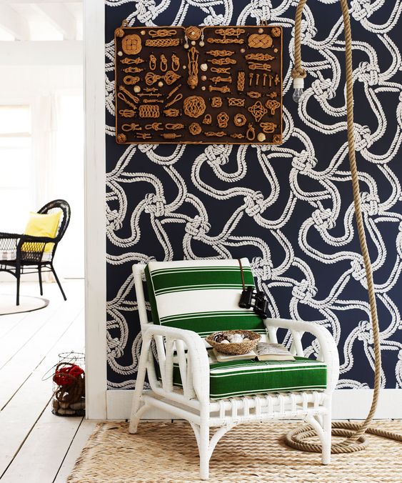 navy and white nautical statement wallpaper adds chic to the space and makes it feel like coasts