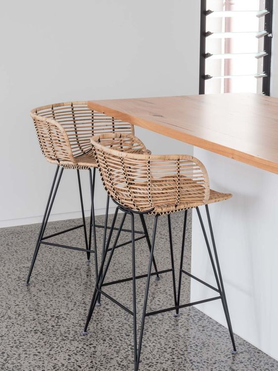 stylish modern rattan stools with metal framing and legs will give an outdoorsy feel to the space