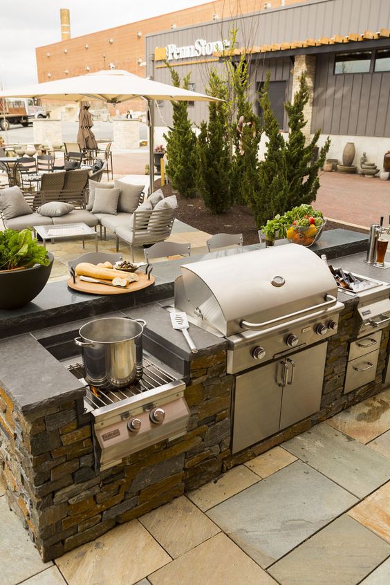a patio, an outdoor kitchen and a dining space for comfortable time outdoors and yummies