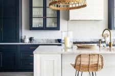 18 a crispy kitchen in black and white looks contrasting and bold and a wicker lampshade and a rattan chair add a relaxed feel