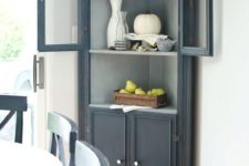 18 a graphite grey corner cabinet for storage and displaying any decorative objects
