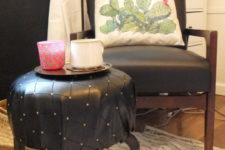 18 an IKEA Frosta stool turned into a chic small ottoman covered with black leather with a shiny touch