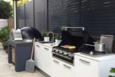 19 a contemporary outdoor kitchen with a grill and a pizza oven is a great idea for every patio