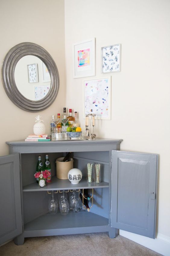 use a corner cabinet to make up a stylish home bar with plenty of storage