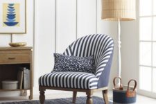 22 a nautical nook with a classic striped chair and a vintage-inspired floor lamp with a wicker lampshade