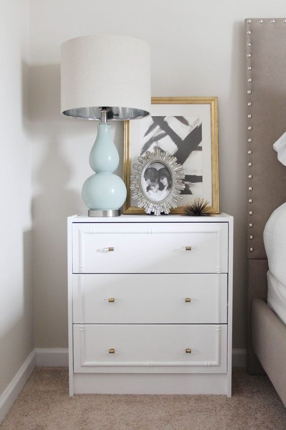 an IKEA Rast dresser redone with inlays and metallic knobs for a glam feel in your bedroom