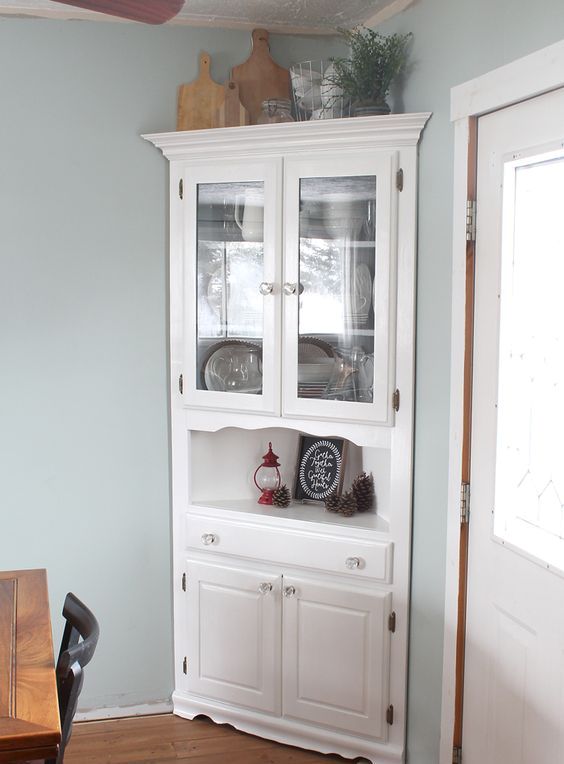 squeeze a corner cabinet into a corner of your dining space to maximize storage space here