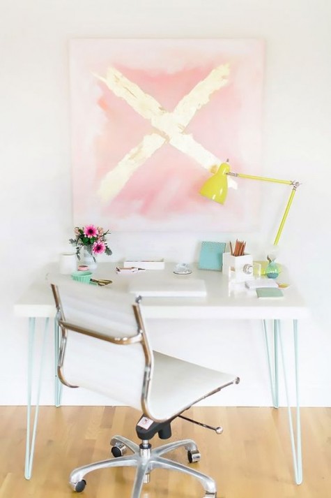 an IKEA Lack coffee table hack into a stylish desk with mint hairpin legs is a perfect fit for a contemporary space