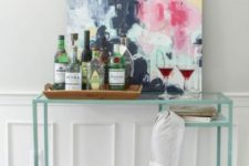 24 an IKEA Vittsjo desk hack into a stylish and contemporary home bar with an acrylic bottom for storage