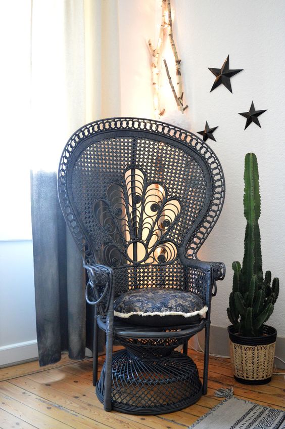 dark painted peacock chairs look very unusual as they are traditionally neutral, here a navy peacock chair for a moody feel