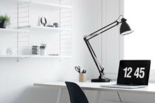 a simple Nordic black and white home office with a white desk, shelving unit, a black chair and a storage fabric basket