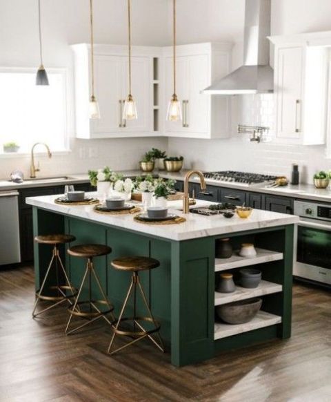 black cabinets with white countertops and a forest green kitchen island with a neutral stone countertop, too