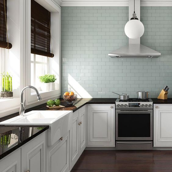 elegant white cabinets are perfectly completed with dark stained countertops and dark shades that match