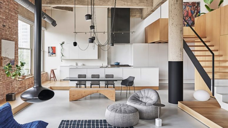 This gorgeous industrial meets minimalist loft features structural details and cool furniture arrangement to get maximum of the apartment