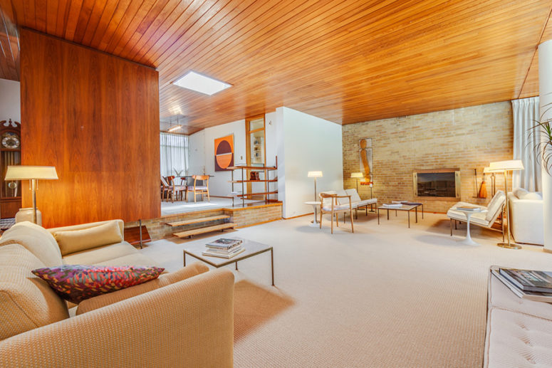 This gorgeous mid century modern home in Toronto is done with amazing honey toned wood, which gives it a character
